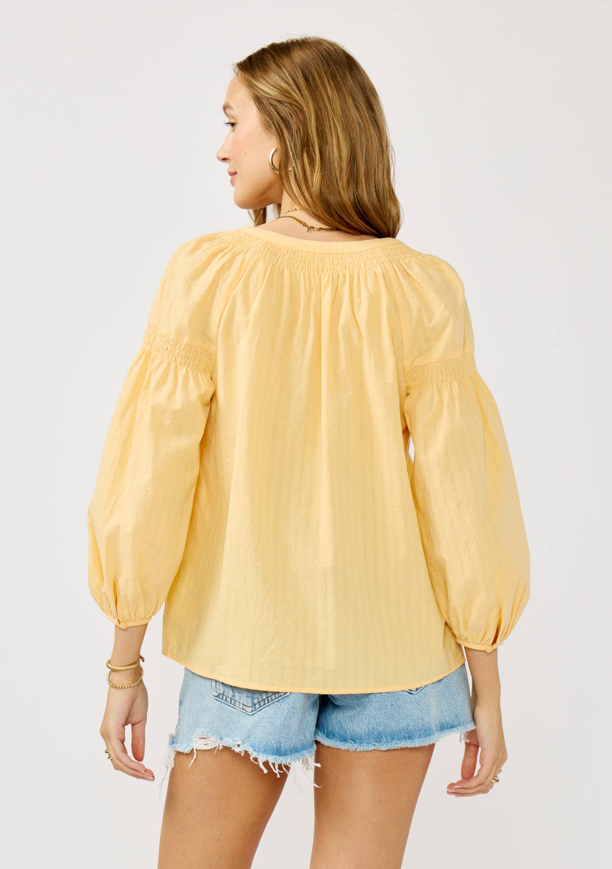 Yellow Jackets 3/4 Sleeve Smocked Henley Blouse: Yellow