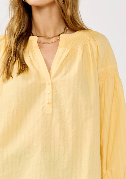 Yellow Jackets 3/4 Sleeve Smocked Henley Blouse: Yellow